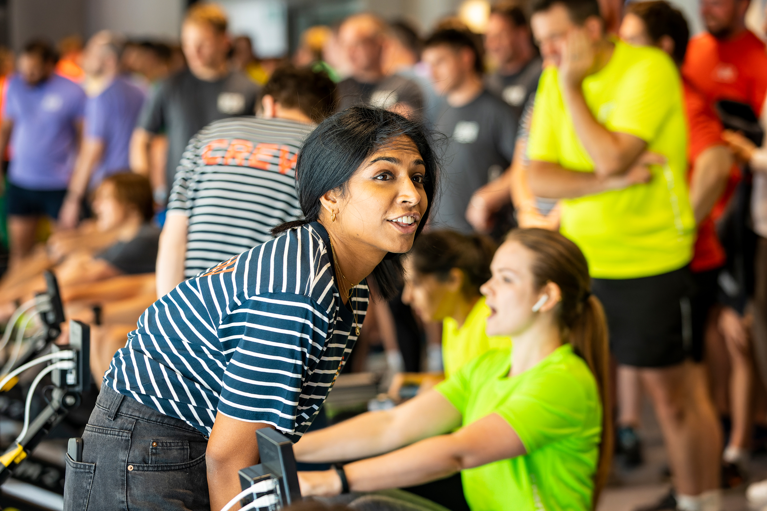 Diverse group engaged in an indoor fitness activity.