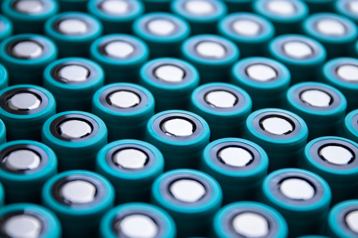 Rows of cylindrical batteries with teal casings.