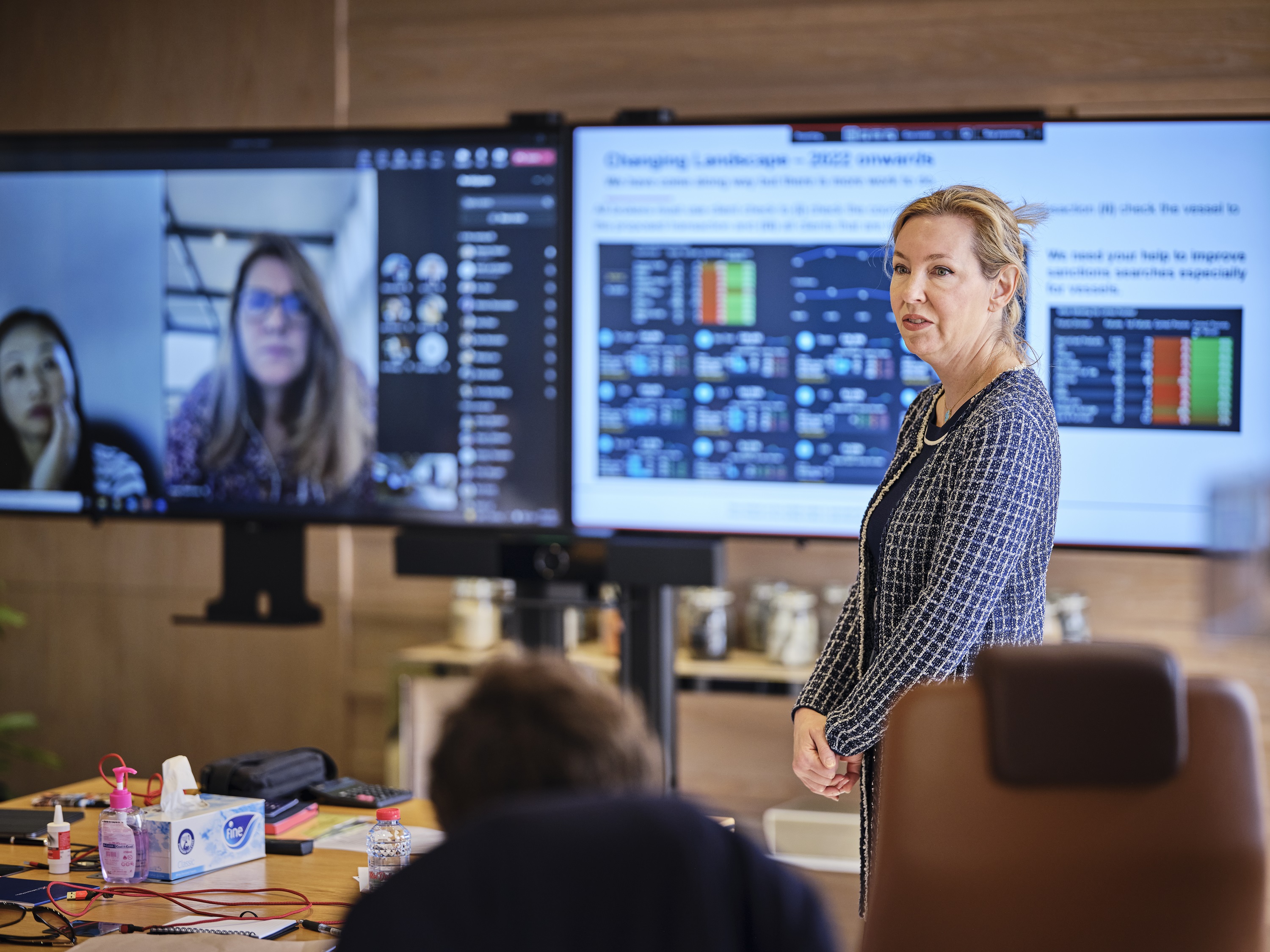 woman standing giving presentation